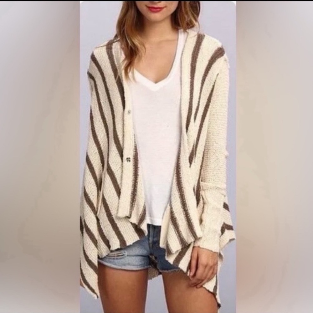 Free People Circle Back Striped Asymmetrical Knit sweater.
